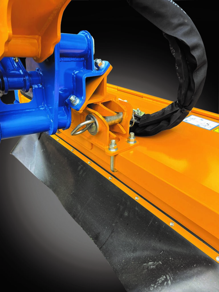 The image depicts a close-up view of a heavy-duty piece of equipment, specifically focusing on a mounting or attachment point. This attachment system may be a quick hitch or similar mechanism used to connect different implements to a tractor or other heavy equipment.