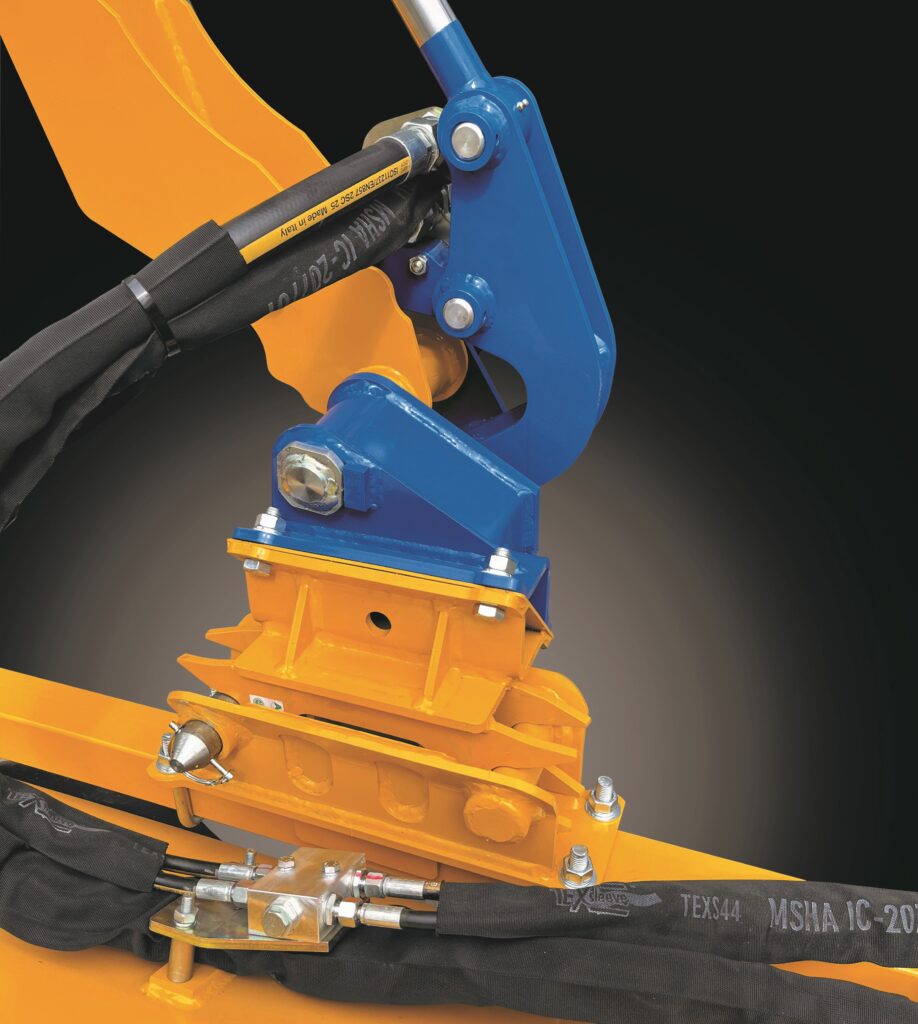 The image depicts a close-up view of a heavy-duty piece of equipment, specifically focusing on a mounting or attachment point. This attachment system may be a quick hitch or similar mechanism used to connect different implements to a tractor or other heavy equipment.